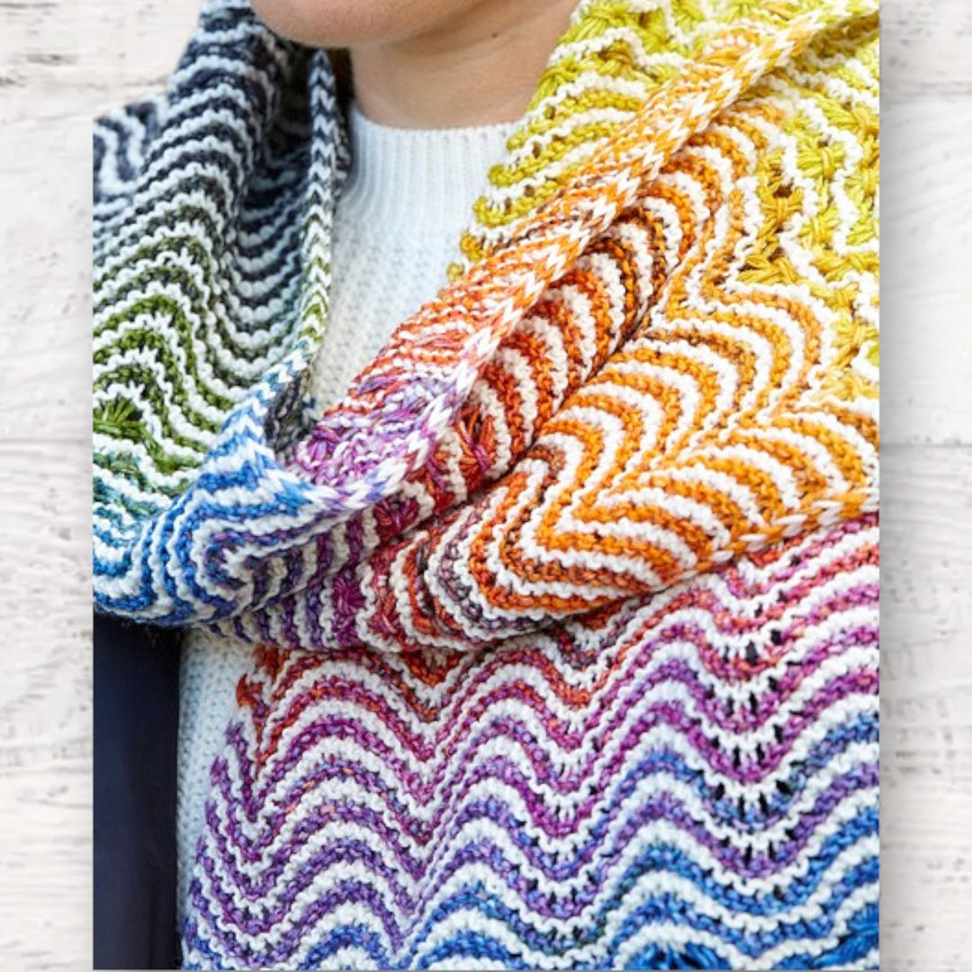 Fuzzy Goat Urth Yarns Yildiz scarf featuring a vibrant gradient chevron knit pattern in merino wool.